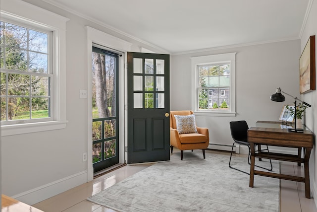 foyer entrance with ornamental molding, baseboard heating, and baseboards