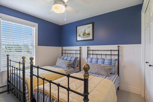 42 Snowberry Dr, Gorham, ME 04038 - carpeted bedroom featuring wainscoting, a closet, and a ceiling fan