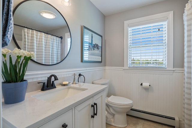 42 Snowberry Dr, Gorham, ME 04038 - full bath with a baseboard radiator, a wainscoted wall, plenty of natural light, toilet, and vanity