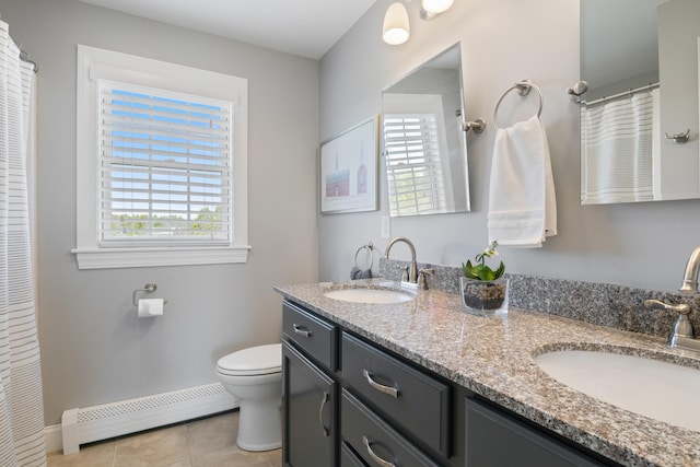 42 Snowberry Dr, Gorham, ME 04038 - bathroom featuring baseboard heating, plenty of natural light, toilet, and tile patterned floors