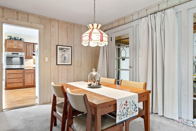 447 Wiscasset Rd, Boothbay, ME 04537 - dining room featuring light colored carpet and wooden walls