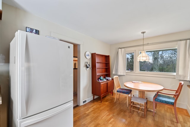 447 Wiscasset Rd, Boothbay, ME 04537 - dining room featuring light wood-style floors and baseboards