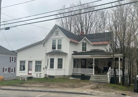 627 Prospect Ave, Rumford, ME 04276 - view of front of property with a porch and a chimney