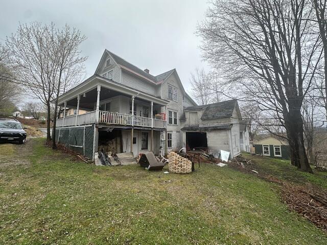 627 Prospect Ave, Rumford, ME 04276 - rear view of house with a lawn