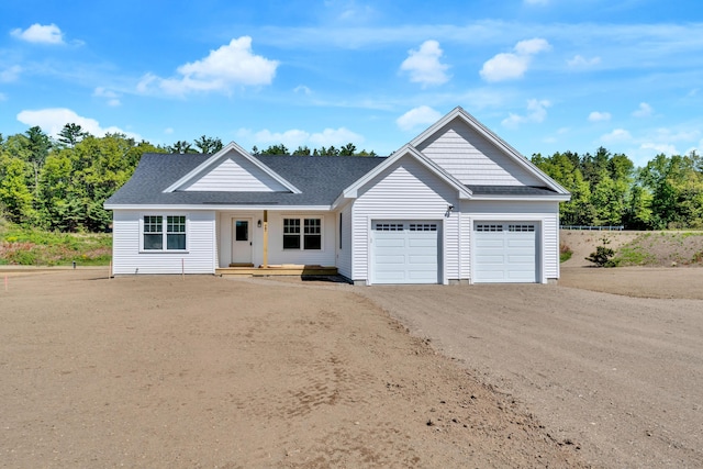 LOT11 Laney Ln, Wells, ME 04090 - view of front facade with an attached garage, driveway, a shingled roof, and a porch