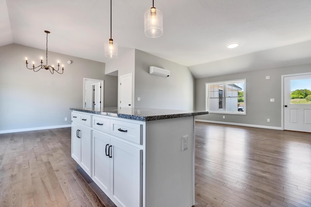 LOT11 Laney Ln, Wells, ME 04090 - kitchen featuring vaulted ceiling, a center island, wood finished floors, a wall mounted AC, and a chandelier