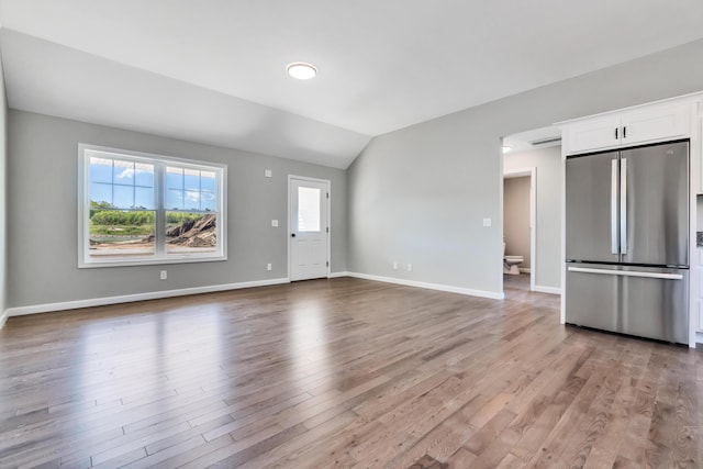 LOT11 Laney Ln, Wells, ME 04090 - unfurnished living room featuring lofted ceiling, light wood-style flooring, and baseboards