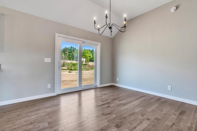 LOT11 Laney Ln, Wells, ME 04090 - spare room featuring a chandelier, wood finished floors, baseboards, a smoke detector, and high vaulted ceiling