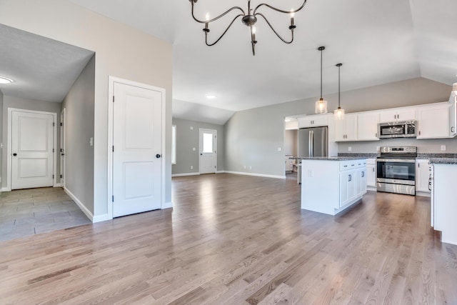 LOT11 Laney Ln, Wells, ME 04090 - kitchen with stainless steel appliances, lofted ceiling, a center island, white cabinets, and baseboards