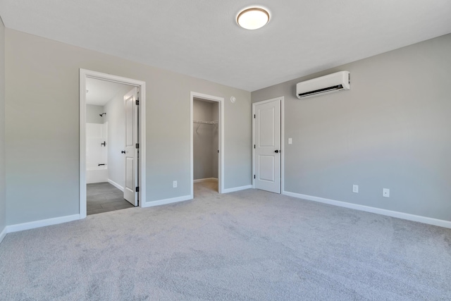 LOT11 Laney Ln, Wells, ME 04090 - unfurnished bedroom with a wall unit AC, carpet flooring, baseboards, a walk in closet, and a closet