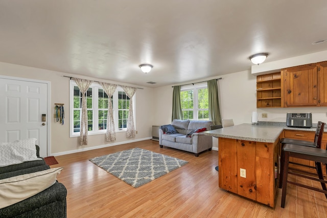 28-30 W Winds Dr, Lebanon, ME 04027 - living area featuring light wood-style flooring and baseboards