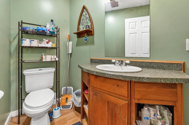 28-30 W Winds Dr, Lebanon, ME 04027 - bathroom featuring vanity, toilet, and wood finished floors