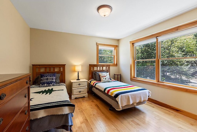 202 Wildewood Ests, Rome, ME 04963 - bedroom with light wood finished floors and baseboards