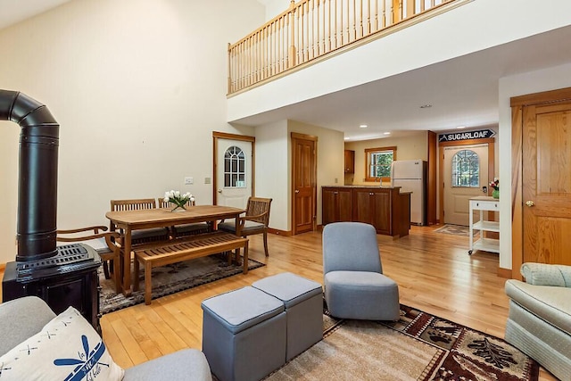 202 Wildewood Ests, Rome, ME 04963 - living room featuring light wood finished floors, a high ceiling, and recessed lighting