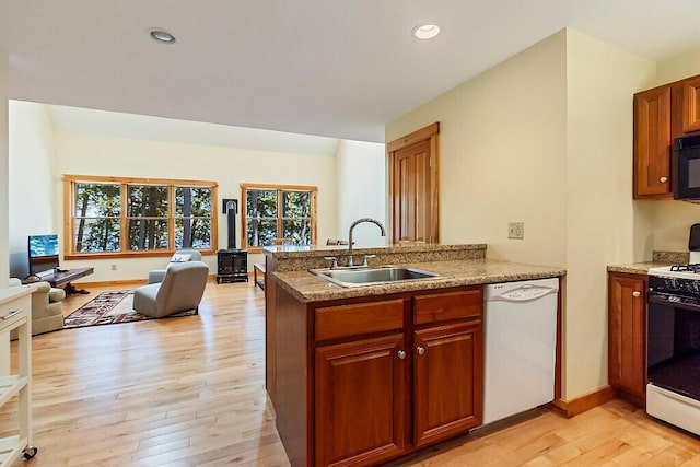 202 Wildewood Ests, Rome, ME 04963 - kitchen with dishwasher, a sink, gas stove, open floor plan, and light wood finished floors