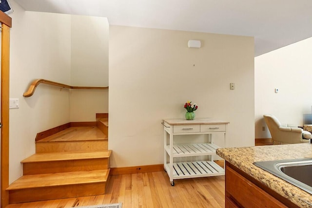202 Wildewood Ests, Rome, ME 04963 - stairs with wood-type flooring and baseboards