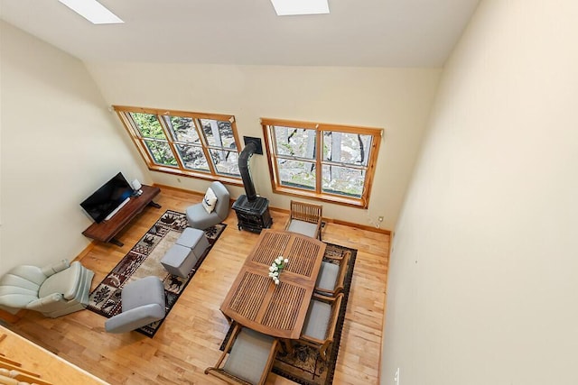 202 Wildewood Ests, Rome, ME 04963 - living area with a skylight, wood finished floors, and lofted ceiling