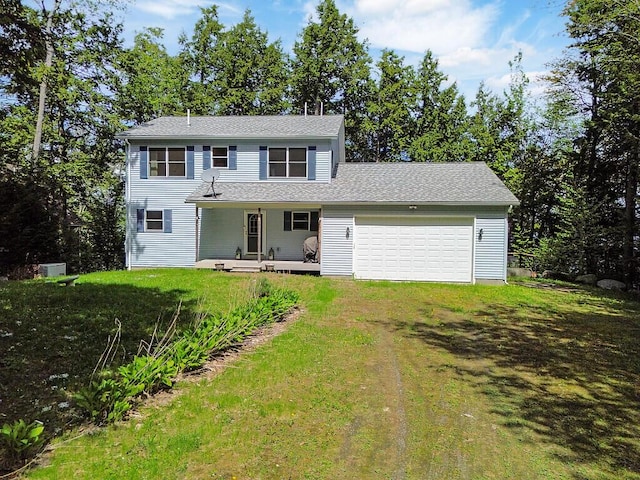 202 Wildewood Ests, Rome, ME 04963 - back of property featuring covered porch, an attached garage, dirt driveway, a lawn, and a shingled roof