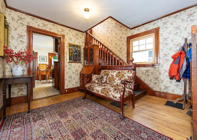 15 Federal St, Bar Harbor, ME 04609 - stairs featuring wood-type flooring, wallpapered walls, ornamental molding, and baseboards