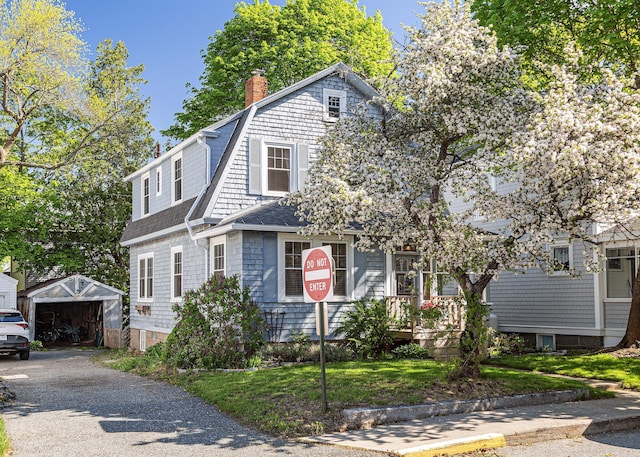 15 Federal St, Bar Harbor, ME 04609 - view of front of property with a shingled roof, an outdoor structure, a gambrel roof, and a chimney