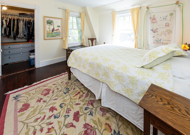 15 Federal St, Bar Harbor, ME 04609 - bedroom with baseboards, hardwood / wood-style flooring, multiple windows, and a spacious closet