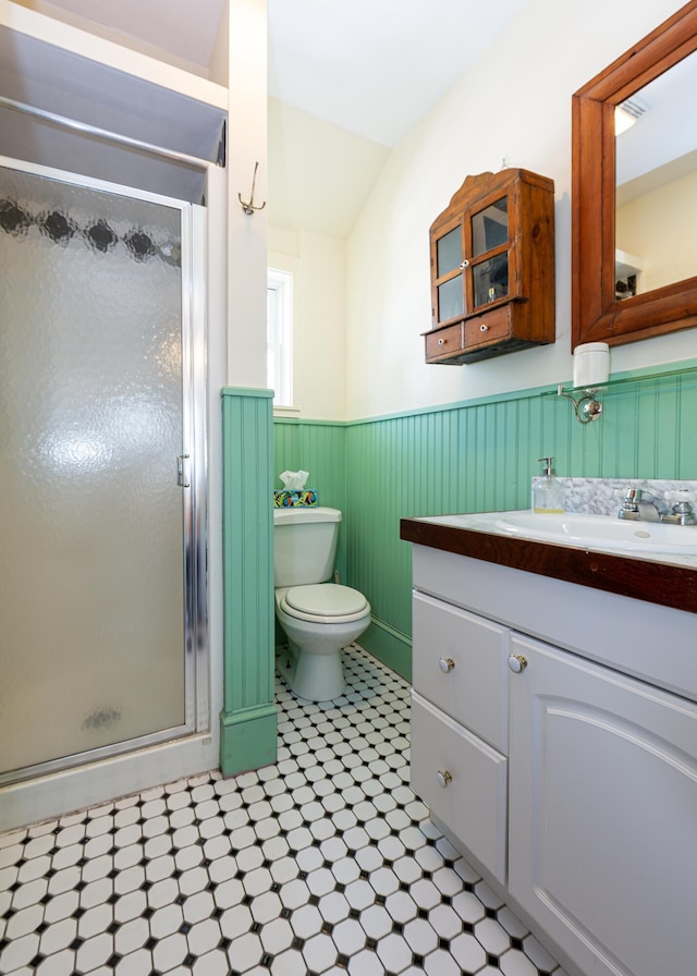 15 Federal St, Bar Harbor, ME 04609 - bathroom with wainscoting, vanity, a stall shower, toilet, and tile patterned floors