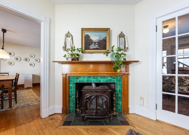 15 Federal St, Bar Harbor, ME 04609 - detailed view of wood finished floors, baseboards, a wood stove, and crown molding