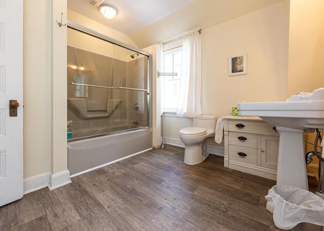 15 Federal St, Bar Harbor, ME 04609 - full bath featuring wood finished floors, toilet, shower / bath combination with glass door, and baseboards