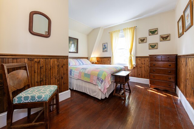 15 Federal St, Bar Harbor, ME 04609 - bedroom with a wainscoted wall, wooden walls, hardwood / wood-style floors, and lofted ceiling