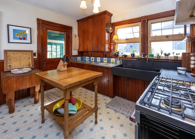 15 Federal St, Bar Harbor, ME 04609 - kitchen featuring light floors, stainless steel gas range oven, and dark countertops
