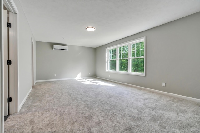 LOT10 Laney Ln, Wells, ME 04090 - empty room with an AC wall unit, carpet, and baseboards