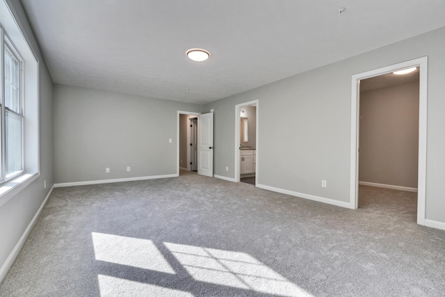 LOT10 Laney Ln, Wells, ME 04090 - unfurnished bedroom with carpet, baseboards, a walk in closet, and ensuite bath
