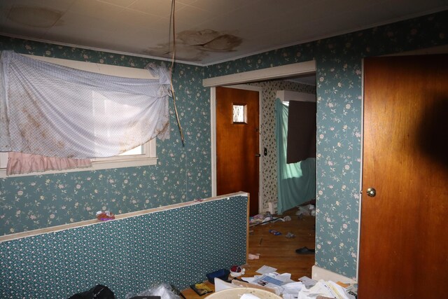 17 Heselton St, Skowhegan, ME 04976 - interior space with wallpapered walls, wood finished floors, and crown molding