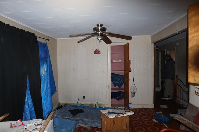 17 Heselton St, Skowhegan, ME 04976 - unfurnished living room with ceiling fan, ornamental molding, and wooden walls