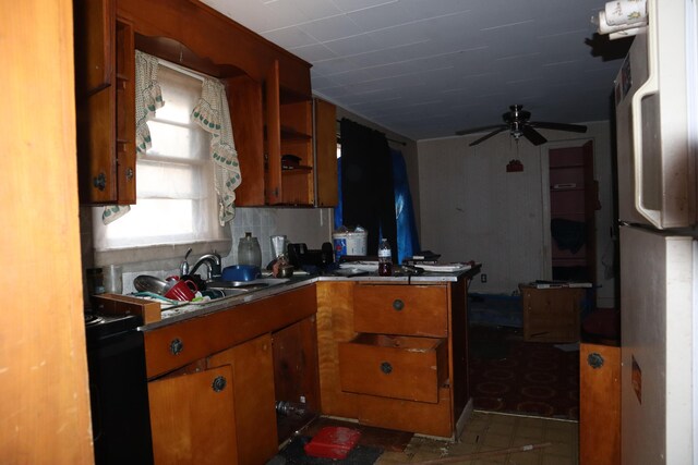 17 Heselton St, Skowhegan, ME 04976 - kitchen featuring freestanding refrigerator, brown cabinets, ceiling fan, open shelves, and a peninsula