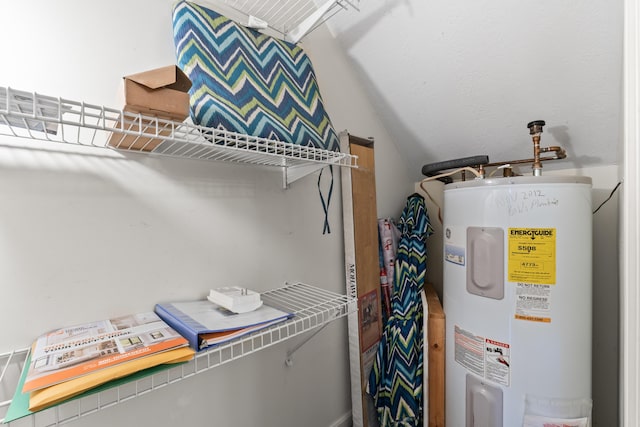 utility room with electric water heater