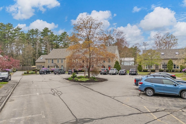 view of asphalt road with a residential view