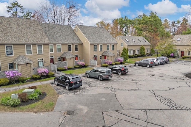 view of asphalt road featuring a residential view