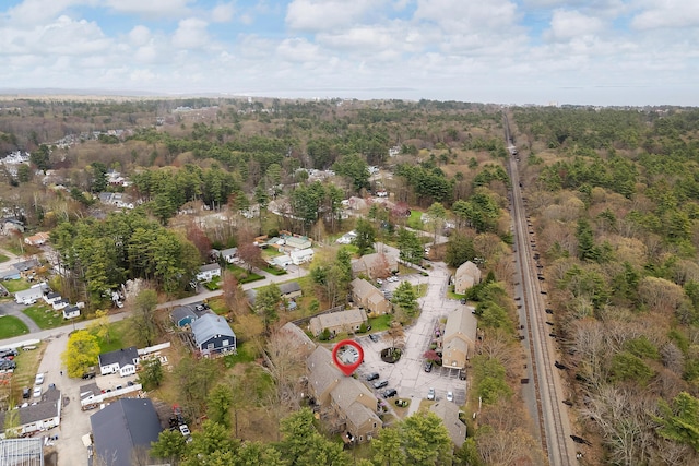 aerial overview of property's location featuring a heavily wooded area