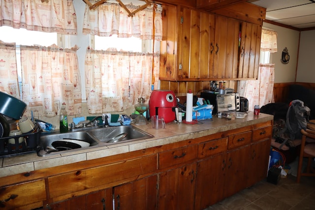 1003-1005 Main St, Vassalboro, ME 04989 - kitchen with brown cabinets and tile countertops