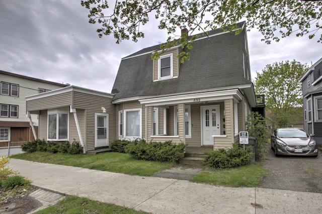 532 Main St, South Portland, ME 04106 - colonial inspired home featuring a porch, a chimney, and roof with shingles