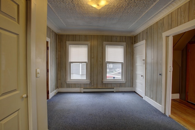 532 Main St, South Portland, ME 04106 - carpeted spare room with baseboard heating, an ornate ceiling, crown molding, and baseboards