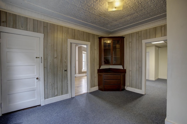 532 Main St, South Portland, ME 04106 - unfurnished room featuring wood walls, an ornate ceiling, carpet, baseboards, and ornamental molding