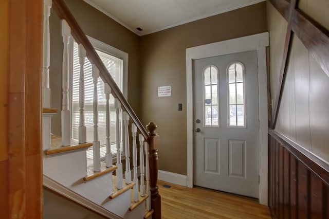532 Main St, South Portland, ME 04106 - foyer featuring light wood-type flooring, crown molding, stairway, and baseboards
