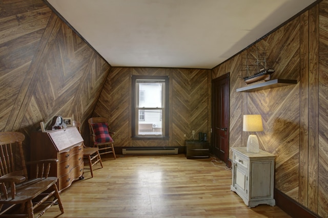 532 Main St, South Portland, ME 04106 - additional living space with a baseboard heating unit, light wood-type flooring, and wooden walls
