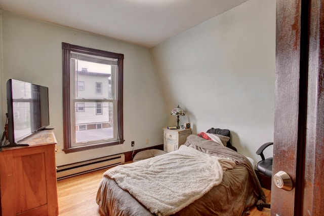 532 Main St, South Portland, ME 04106 - bedroom featuring a baseboard radiator and light wood-type flooring