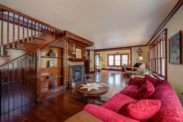 25 Winds Way Dr, Nobleboro, ME 04555 - living room with wood finished floors, a fireplace, ornamental molding, and stairs