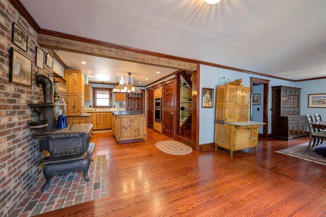 25 Winds Way Dr, Nobleboro, ME 04555 - living room with a wood stove, crown molding, dark wood-style flooring, and baseboards