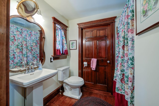 25 Winds Way Dr, Nobleboro, ME 04555 - bathroom featuring wood finished floors, toilet, and baseboards
