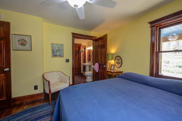 25 Winds Way Dr, Nobleboro, ME 04555 - bedroom with dark wood-type flooring, baseboards, ceiling fan, and ensuite bath